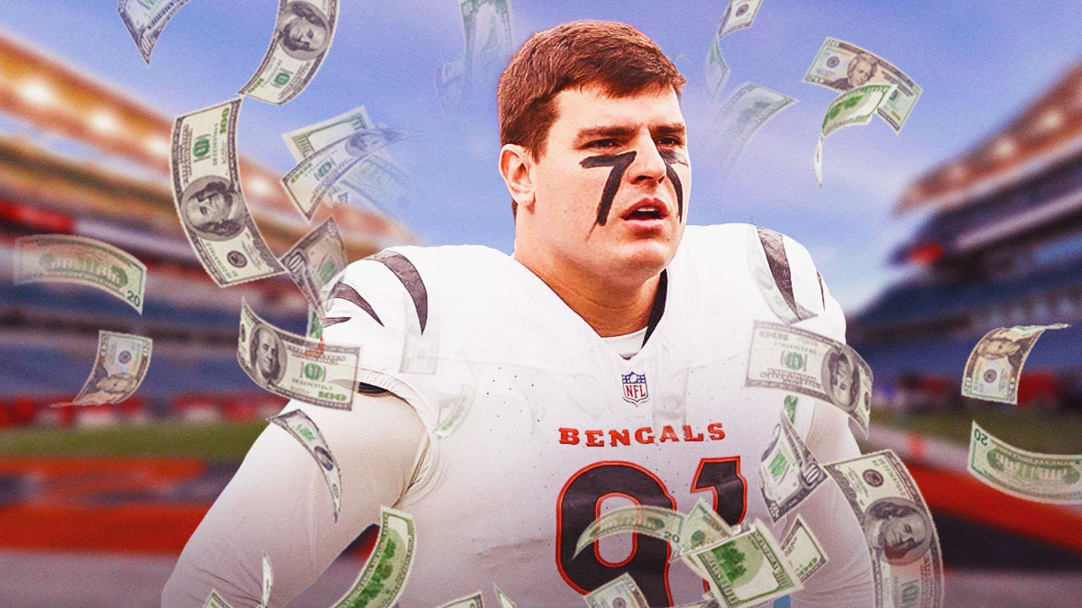 Trey Hendrickson, dollar bills all around him.