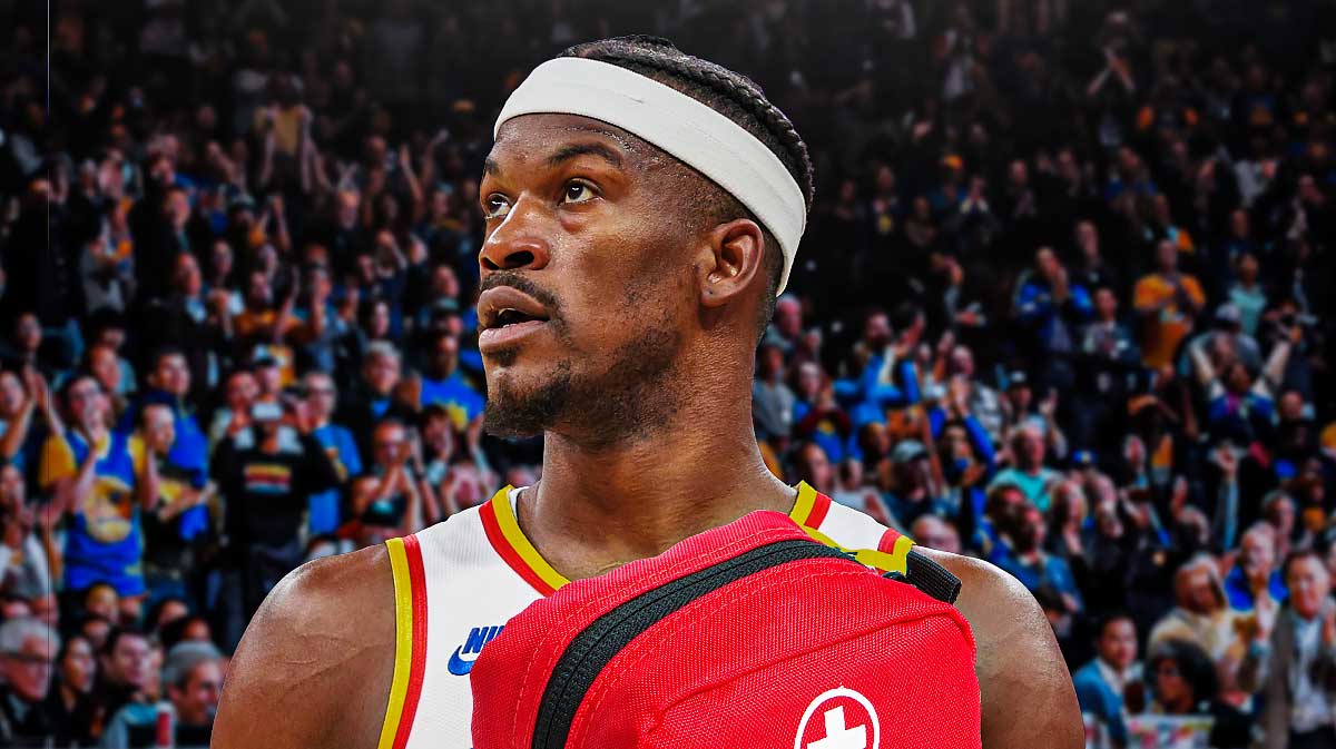 Jimmy Butler (Warriors) shooting a ball but REPLACE the ball with just a medical cross symbol.