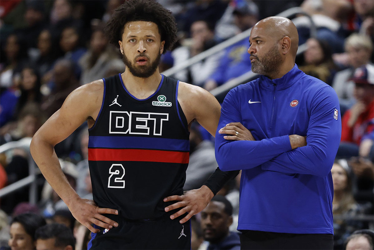 Detroit Pistons head coach J.B. Bickerstaff talks to guard Cade Cunningham (2) in the second half against the Brooklyn Nets at Little Caesars Arena. 