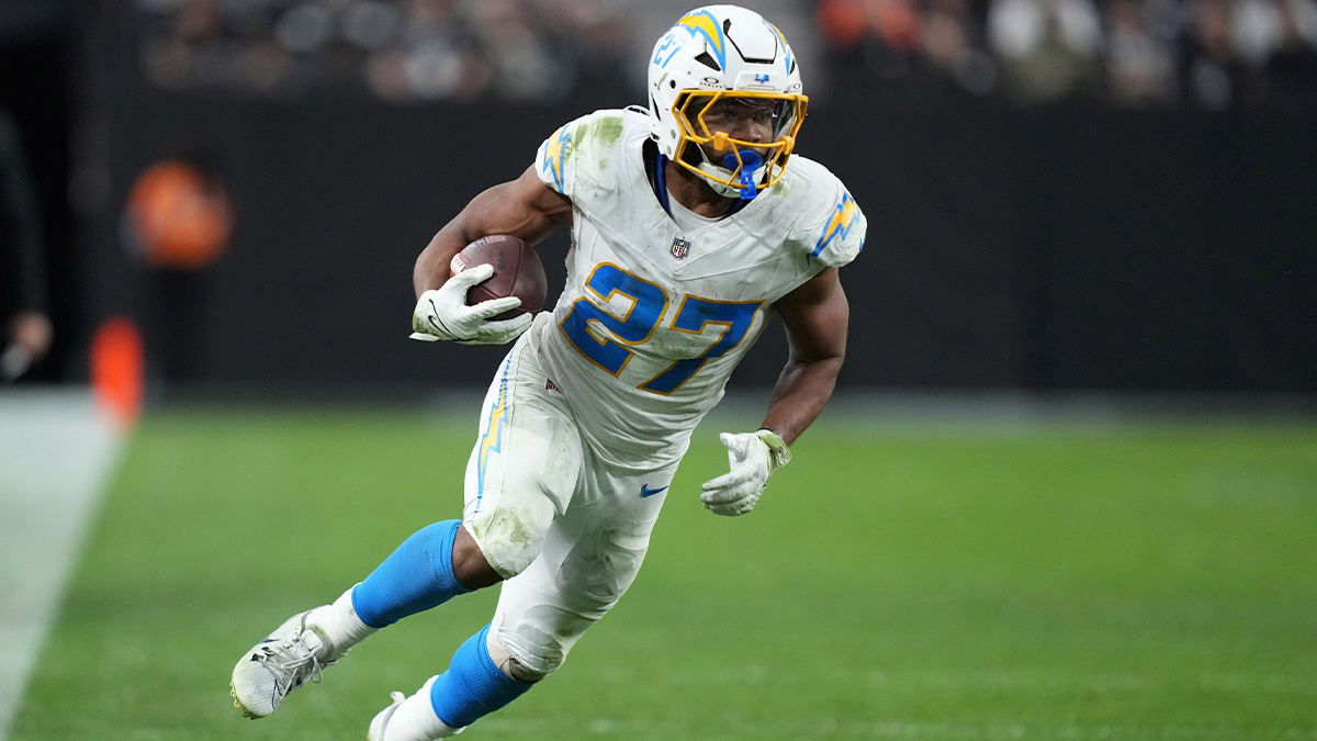 Jan 5, 2025; Paradise, Nevada, USA; Los Angeles Chargers running back JK Dobbins (27) carries the ball against the Las Vegas Raiders in the second half at Allegiant Stadium.