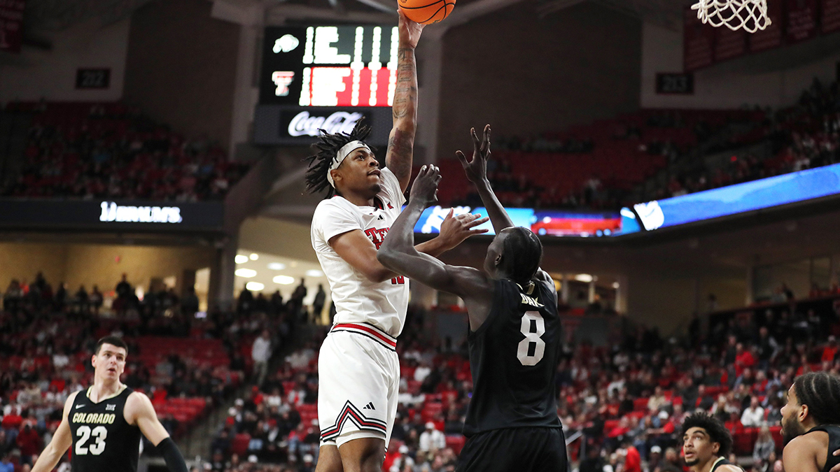 Texas Tech Red Raiders forward JT Toppin (15) shoots over Colorado Buffaloes forward Bangot Dak (8) in the first half at United Supermarkets Arena.