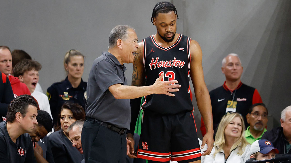 Houston Cougars head coach Kelvin Sampson speaks with forward J'Wan Roberts (13) during a break in play against the Baylor Bears during the first half at Paul and Alejandra Foster Pavilion.
