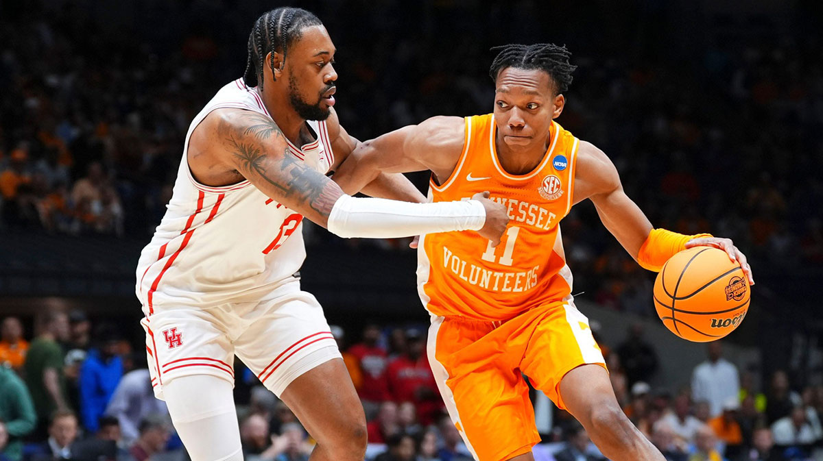 Tennessee guard Jordan Gainey (11) moves the ball while guarded by Houston forward J'Wan Roberts (13) during a NCAA Tournament Elite Eight game between Tennessee and Houston at Lucas Oil Stadium in Indianapolis, Ind., on Sunday, March 30, 2025.