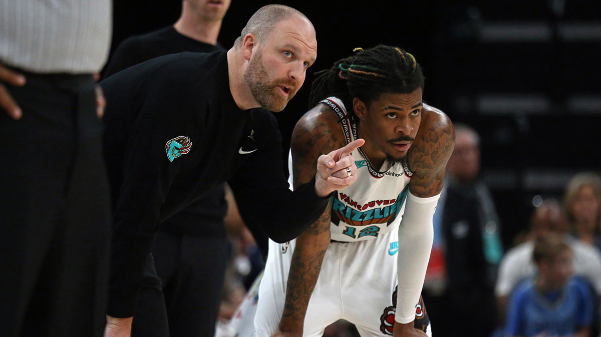 Memphis Grizzlies head coach Taylor Jenkins (left) talks with guard Ja Morant (12) during the third quarter against the New York Knicks at FedExForum.