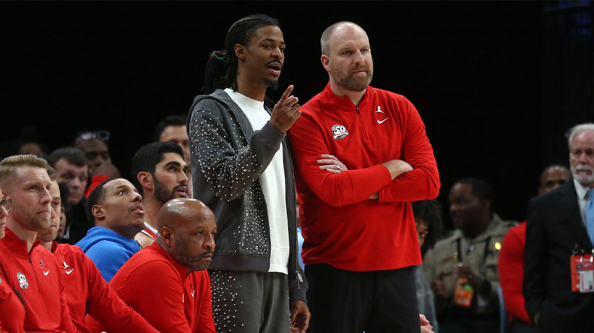 Memphis Grizzlies guard Ja Morant (left) talks with head coach Taylor Jenkins during the fourth quarter against the San Antonio Spurs at FedExForum.