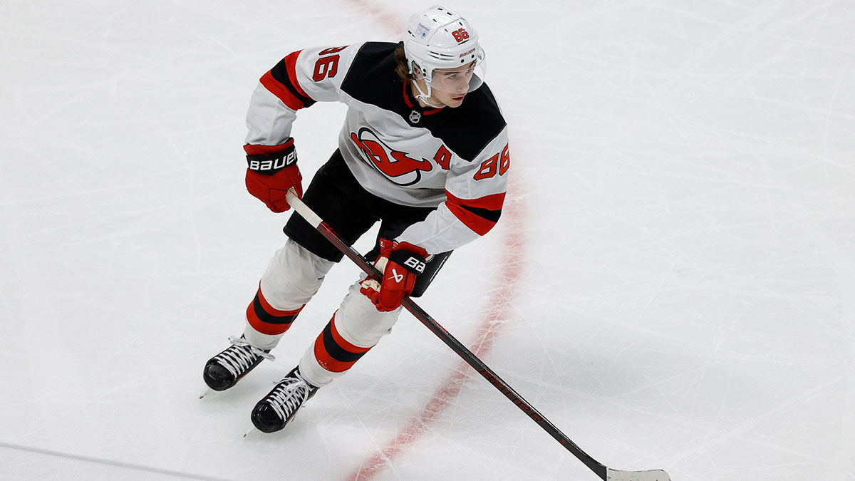 New Jersey Devils center Jack Hughes (86) controls the puck in the first period against the Colorado Avalanche at Ball Arena.