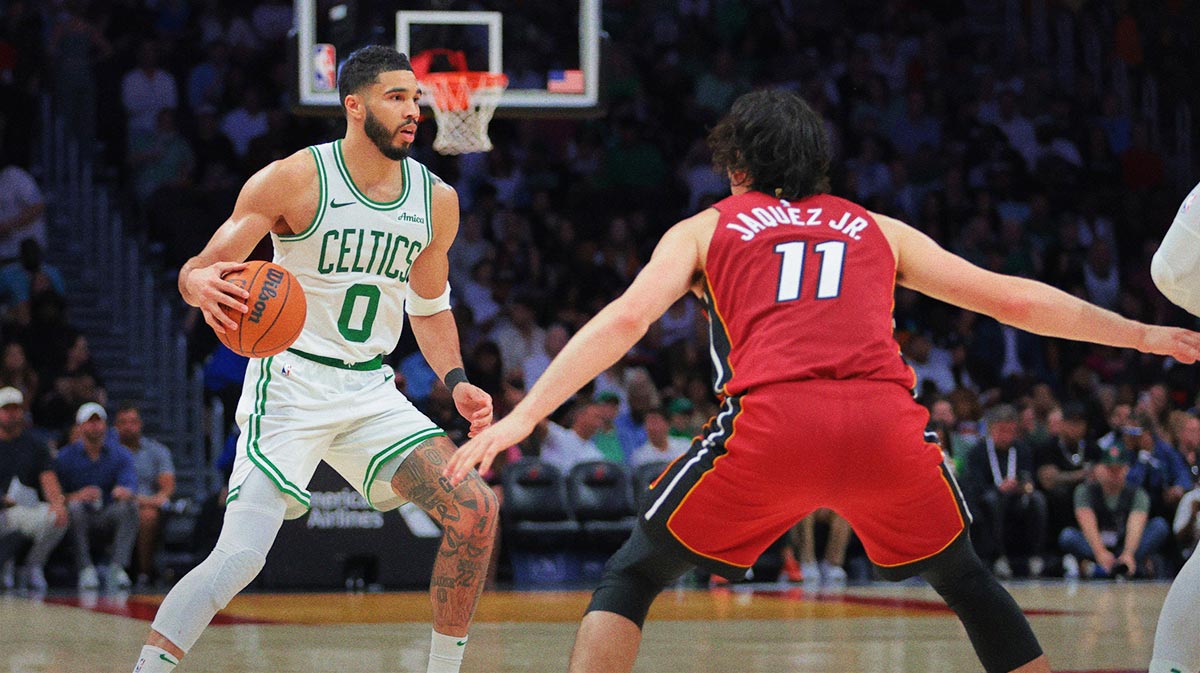 Boston Celtics Forward Jaison Tatum (0) Driblible Basketball against Miami Heart Guard Jaime Jakuez Jr. (11) During the third quarter in the Cashier Center.