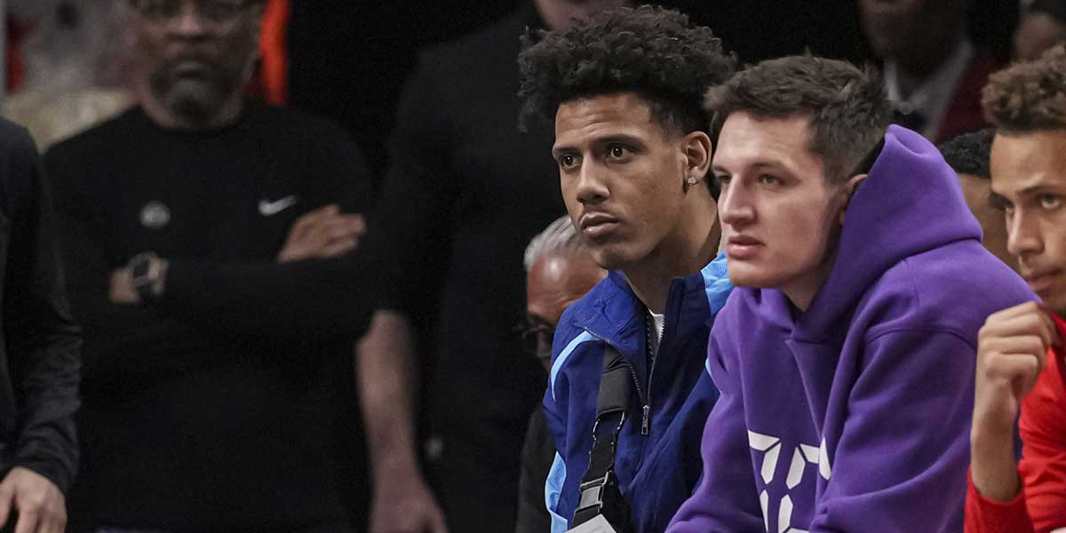 Atlanta Hawks injured players forward Jalen Johnson (1) and guard Vit Krejci (27) sit on the bench during the game against the Miami Heat at State Farm Arena. 