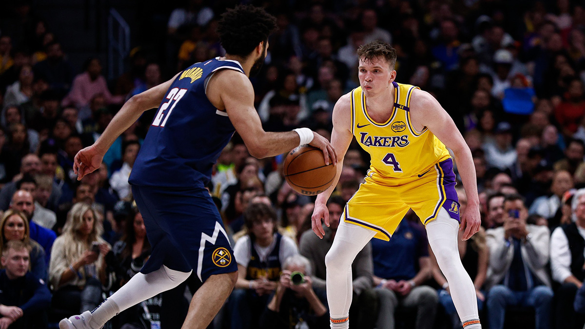 Denver Nuggets Guard Jamal Murrai (27) Controls the ball like Los Angeles Lakers Guard Dalton Knecht (4) guards in the fourth quarter quarter.