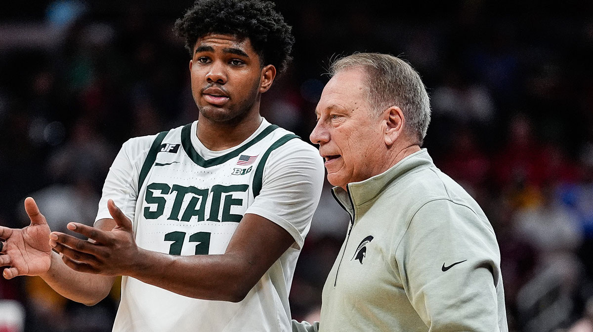 Michigan State guard Jase Richardson (11) talks to head coach Tom Izzo before a play against Wisconsin during the first half of Big Ten Tournament semifinal at Gainbridge Fieldhouse in Indianapolis, Ind. on Saturday, March 15, 2025.