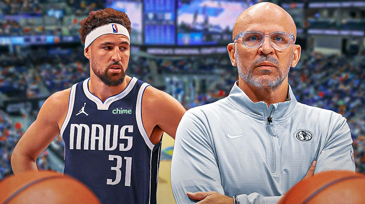 Mavericks Jason Kidd on left coaching during a game. Mavericks Klay Thompson on right looking at Jason Kidd.