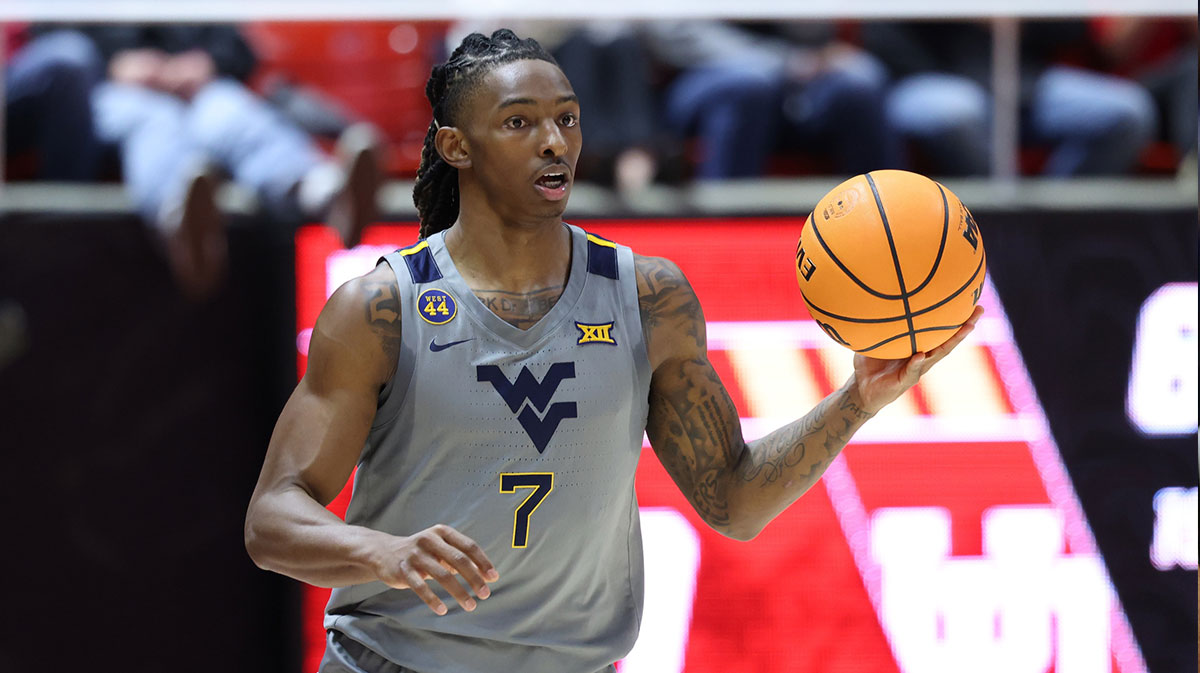 West Virginia Mountaineers guard Javon Small (7) brings the ball up the court against the Utah Utes during the first half at Jon M. Huntsman Center.