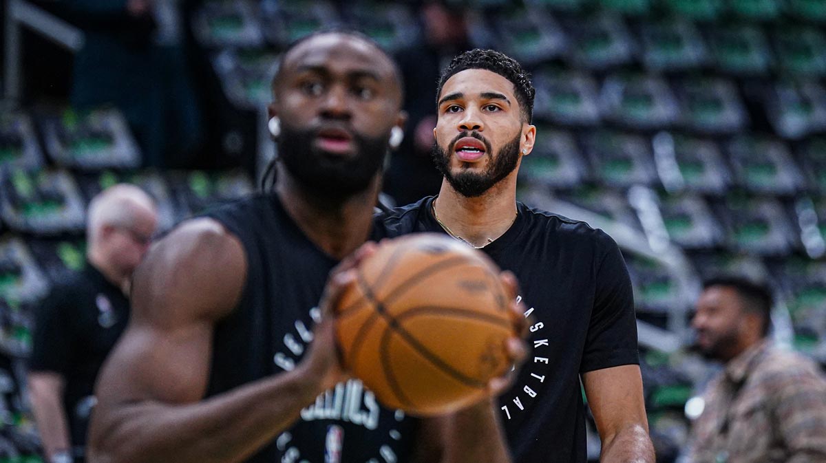 Boston Celtics forward Jayson Tatum (0) and guard Jaylen Brown (7) warm up before the start of the game against the Sacramento Kings at TD Garden.