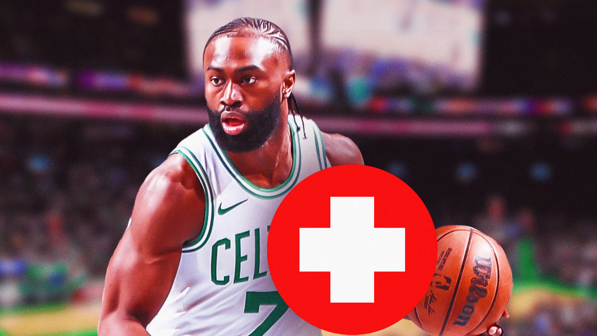 Jaylen Brown playing basketball with a medical cross next to him