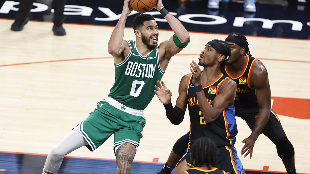 Boston Celtics forward Jayson Tatum (0) shoots the ball over Oklahoma City Thunder guard Shai Gilgeous-Alexander (2) during the third quarter at Paycom Center.