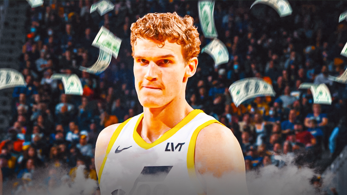 Jazz's Lauri Markkanen sitting on the bench with money around him