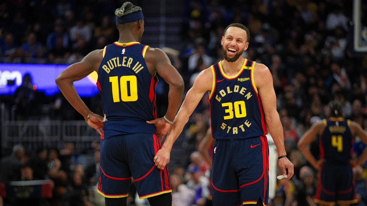 Golden State Warriors forward Jimmy Butler III (10) and guard Stephen Curry (30) share a laugh during the second quarter against the Sacramento Kings at Chase Center.