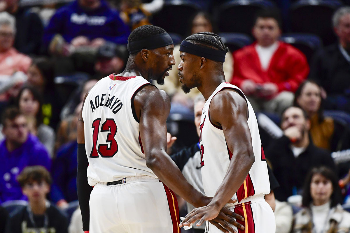Miami Heat forward Jimmy Butler (22) and center/forward Bam Adebayo (13) talk before a free-throw shot against the Utah Jazz during the second half at Vivint Arena.