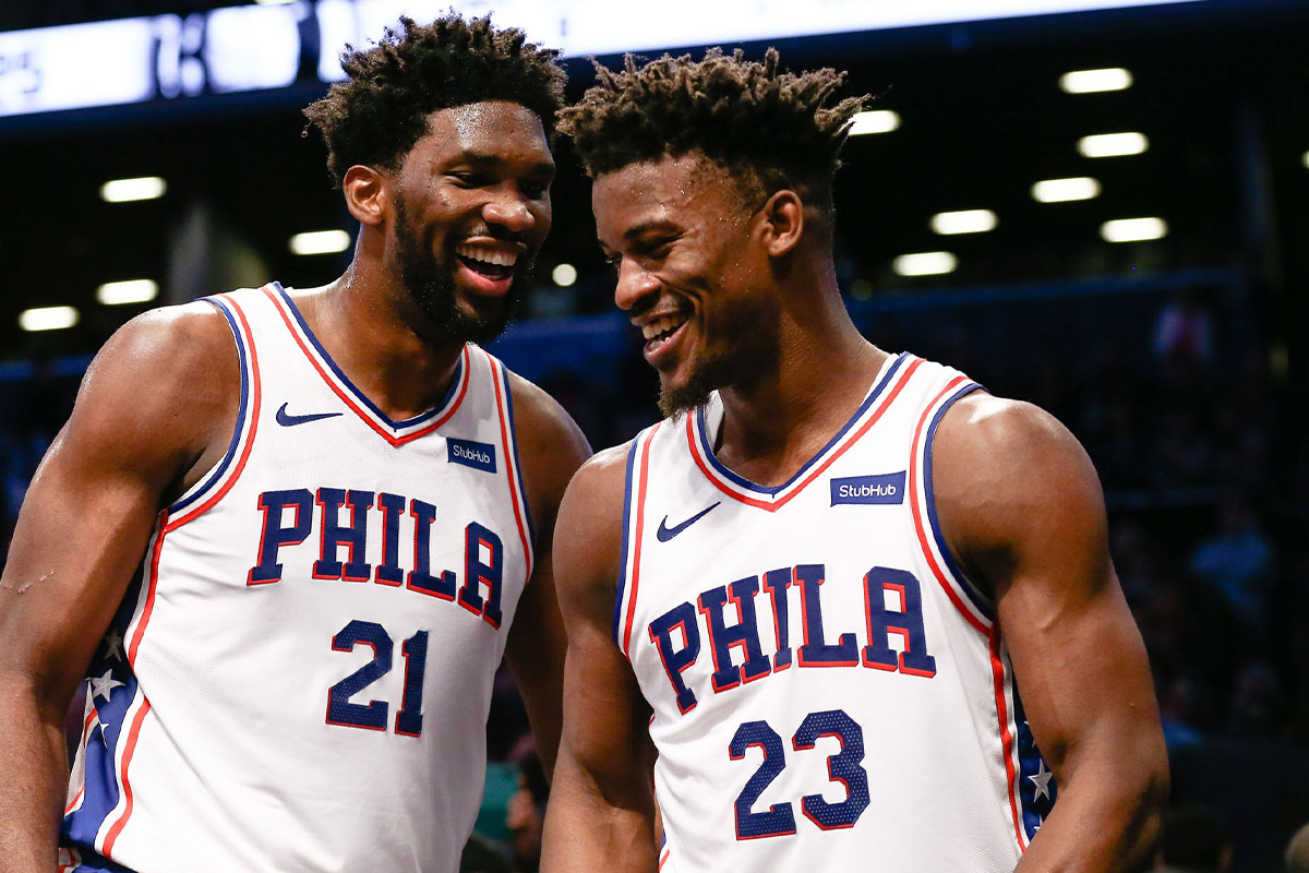 Philadelphia 76ers center Joel Embiid (21) and forward Jimmy Butler (23) react in the fourth quarter against the Brooklyn Nets at Barclays Center.