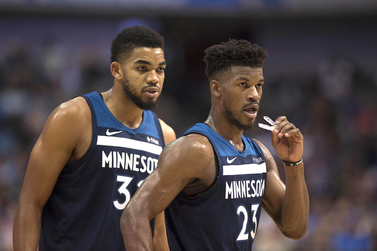 Minnesota Timberwolves center Karl-Anthony Towns (32) and guard Jimmy Butler (23) prepare to face the Dallas Mavericks during the second half at the American Airlines Center. The Timberwolves defeated the Mavericks 111-87.