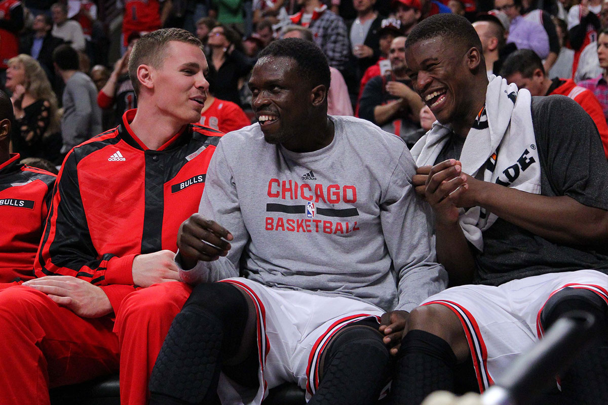 Chicago Bulls power forward Erik Murphy (left) and small forward Luol Deng (center) and shooting guard Jimmy Butler (right) laugh on the bench during the second half against the Indiana Pacers at the United Center. Chicago won 110-94.