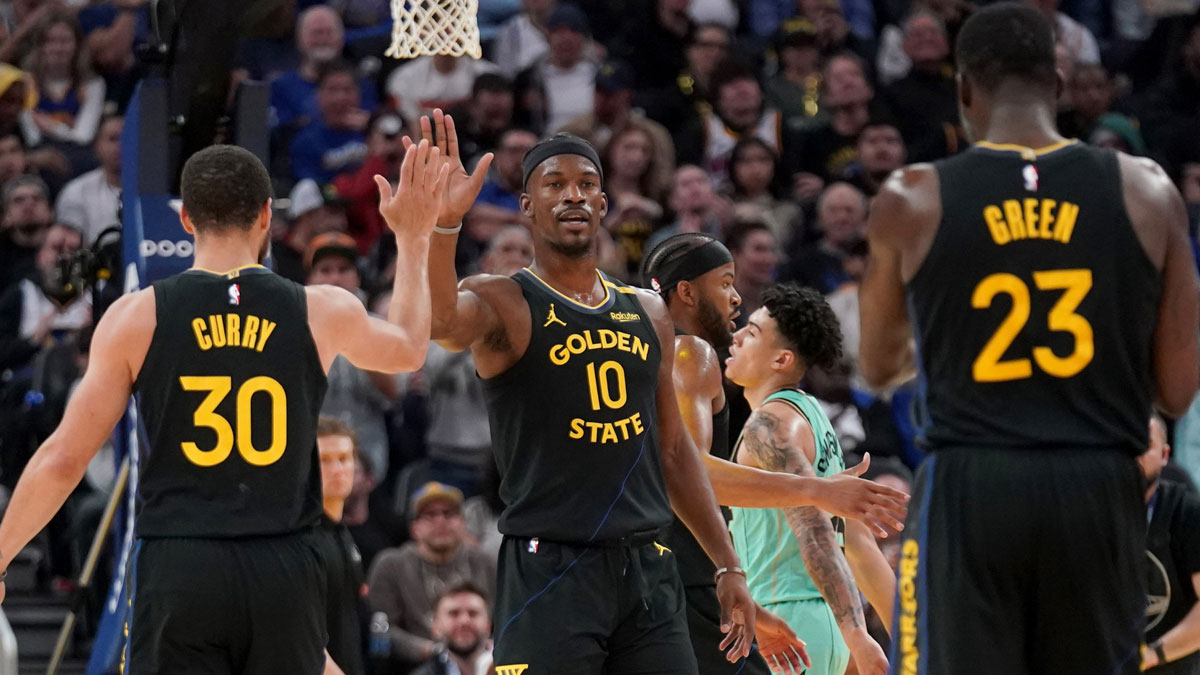 Golden State Warriors Forward Jimmy Butler III (10) congratulate guard Stephen Curry (30) after the basket against Charlotte Hornet in the third quarter of Chese Center.