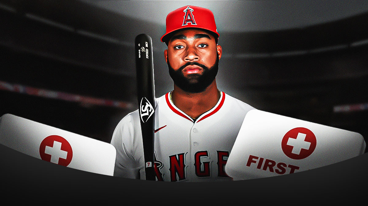 Jo Adell in a Los Angeles Angels uniform with red and white first aid symbol as adell left with an injury against the white sox.
