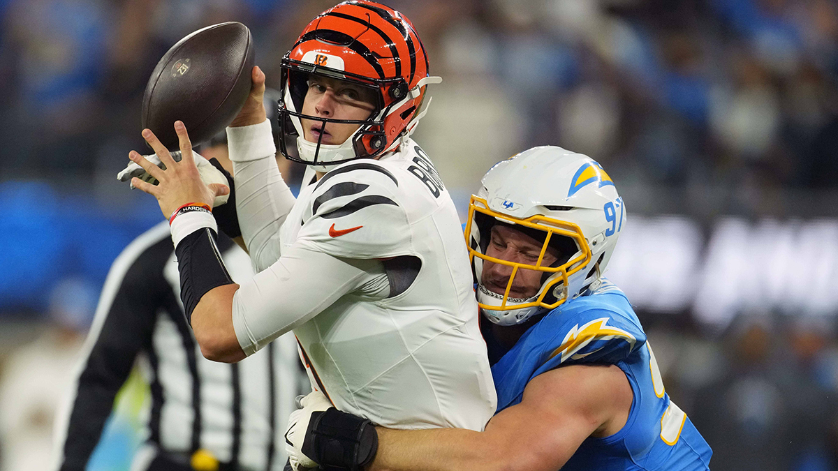 Cincinnati Bengals quarterback Joe Burrow (9) is pressured by Los Angeles Chargers linebacker Joey Bosa (97) in the first half at SoFi Stadium. 