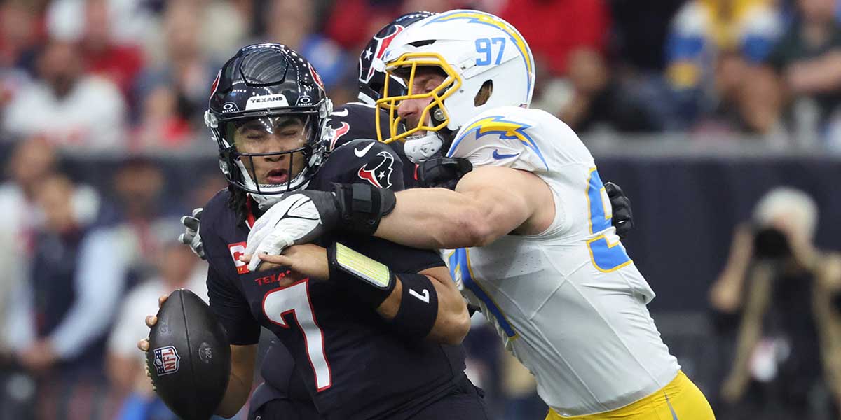 Los Angeles Chargers outside linebacker Joey Bosa (97) sacks Houston Texans quarterback C.J. Stroud (7) during the first quarter in an AFC wild card game at NRG Stadium. Mandatory Credit: Troy Taormina-Imagn Images