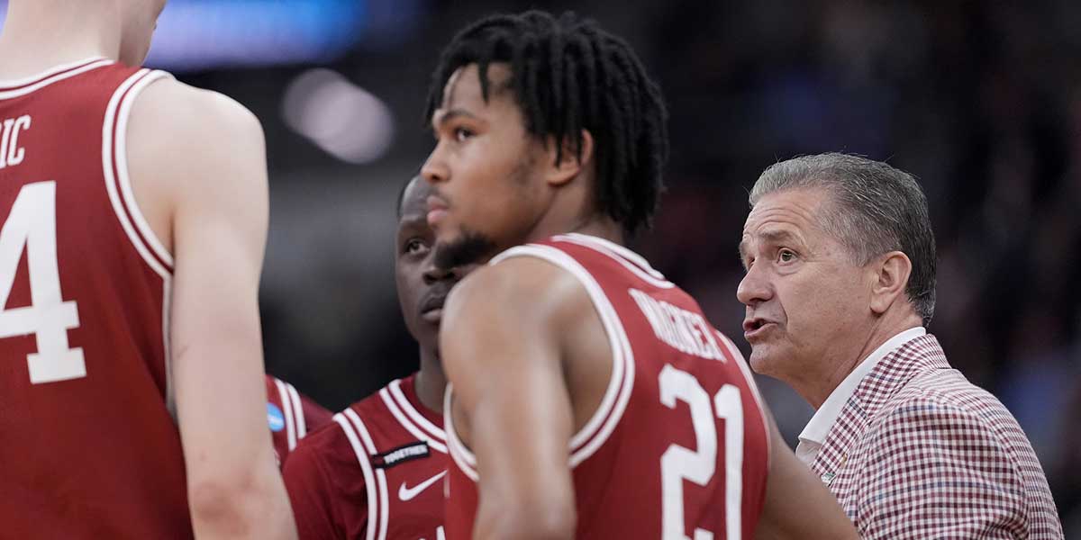 Arkansas Razorbacks head coach John Calipari talks to his team during the first half of a second round men’s NCAA Tournament game against the St. John's Red Storm at Amica Mutual Pavilion. Mandatory Credit: Gregory Fisher-Imagn Images