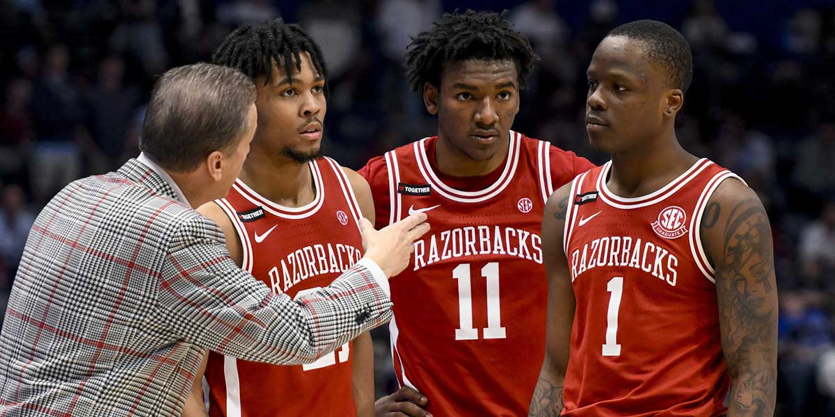 Arkansas Razorbacks head coach John Calipari talks with guard D.J. Wagner (21), forward Karter Knox (11), and guard Johnell Davis (1) against the Mississippi Rebels during the second half at Bridgestone Arena. Mandatory Credit: Steve Roberts-Imagn Images