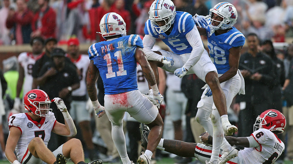 Nov 9, 2024; Oxford, Mississippi, USA; Mississippi Rebels defensive back John Saunders Jr. (5) reacts with linebacker Chris Paul Jr. (11) after a defensive stop during the first half against the Georgia Bulldogs at Vaught-Hemingway Stadium.