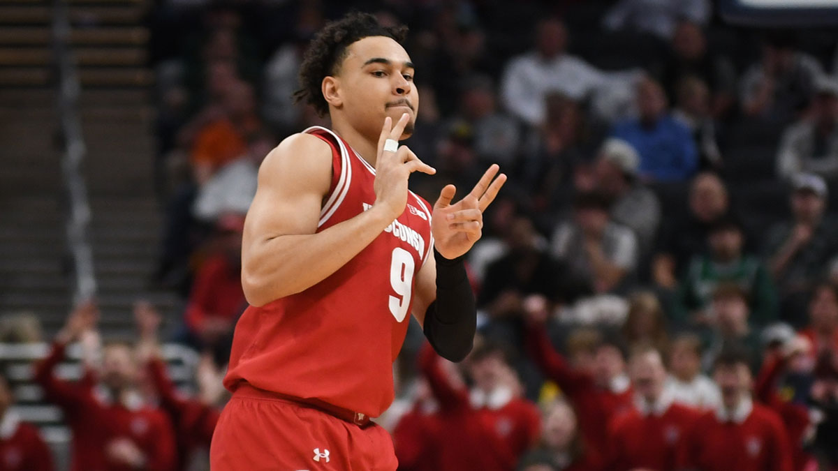 Wisconsin Badgers guard John Tonje (9) celebrates after making a three-point basket during the first half against the Michigan State Spartans at Gainbridge Fieldhouse.