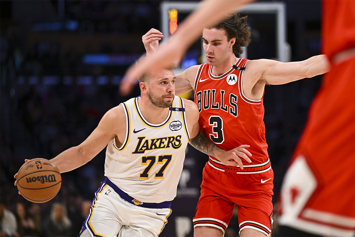 Los Angeles Lakers guard Luka Doncic (77) drives the ball against Chicago Bulls guard Josh Giddey (3) during the first half at Crypto.com Arena.