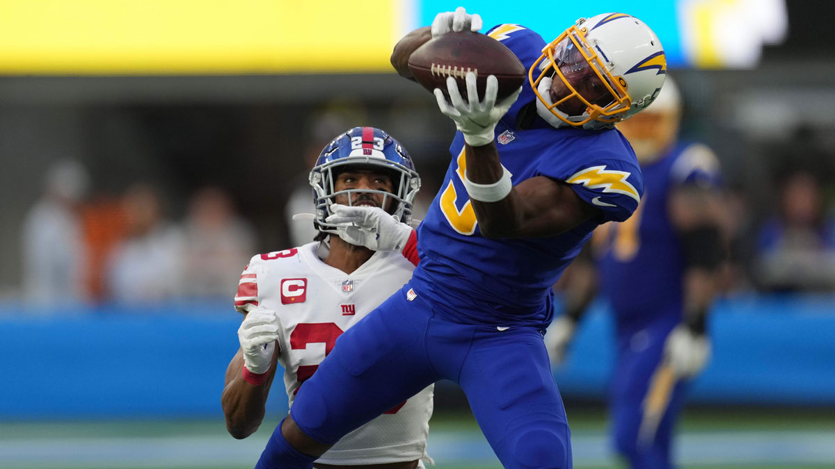 Dec 12, 2021; Inglewood, California, USA; Los Angeles Chargers wide receiver Josh Palmer (5) catches a pass as New York Giants safety Logan Ryan (23) defends in the second hal at SoFi Stadium.