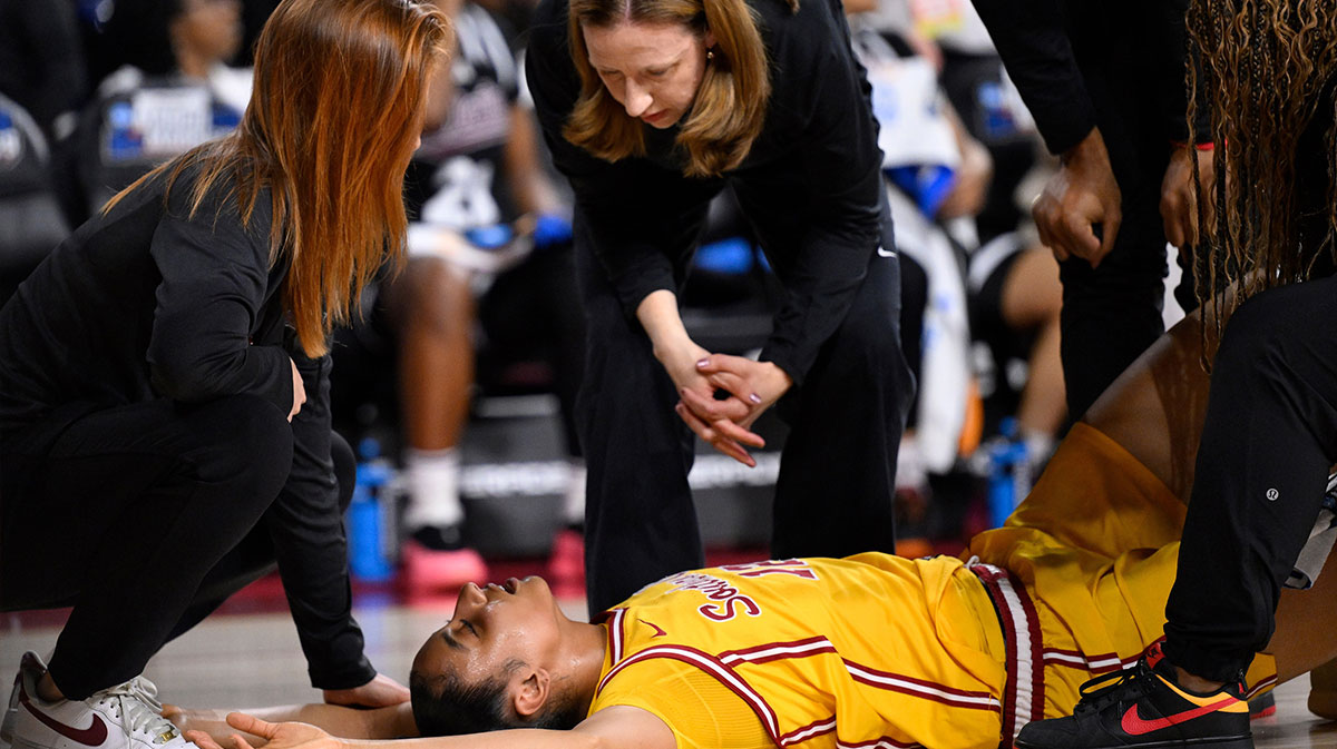 USC Trojans head coach Lindsay Gottlieb talks to JuJu Watkins after the Trogans guard injured he knee in the first quarter of an NCAA Tournament second round game against the Mississippi State Bulldogs at Galen Center.