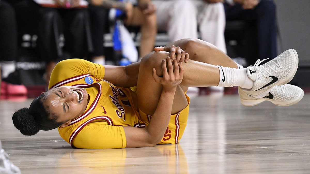 USC Trojans guard JuJu Watkins (12) grabs her knee after falling to the floor during an NCAA Tournament second round game against the Mississippi State Bulldogs at Galen Center.