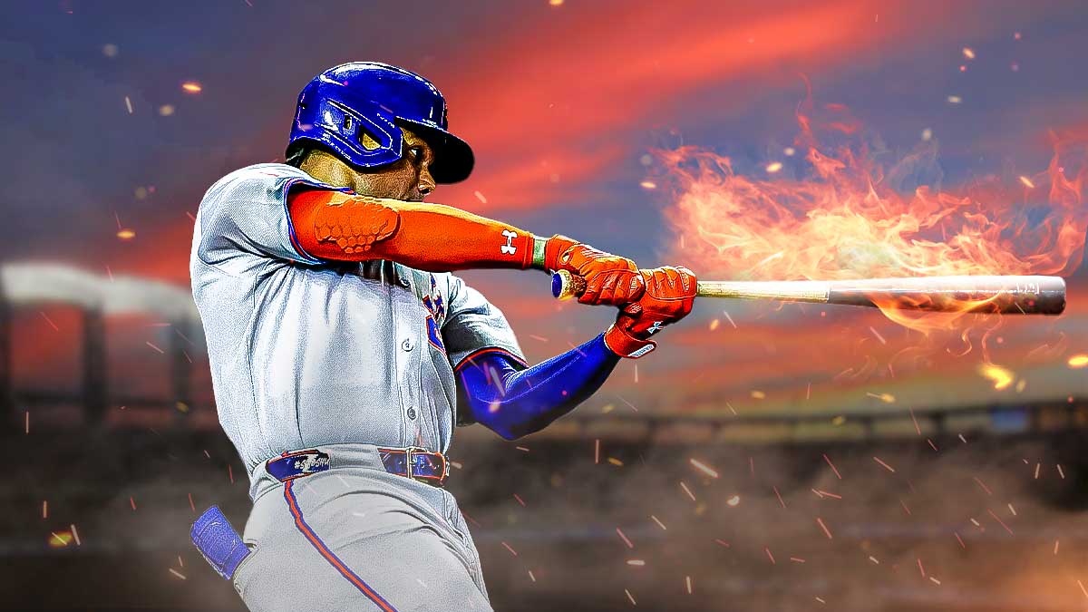 Mets star Juan Soto holding a flaming baseball bat.