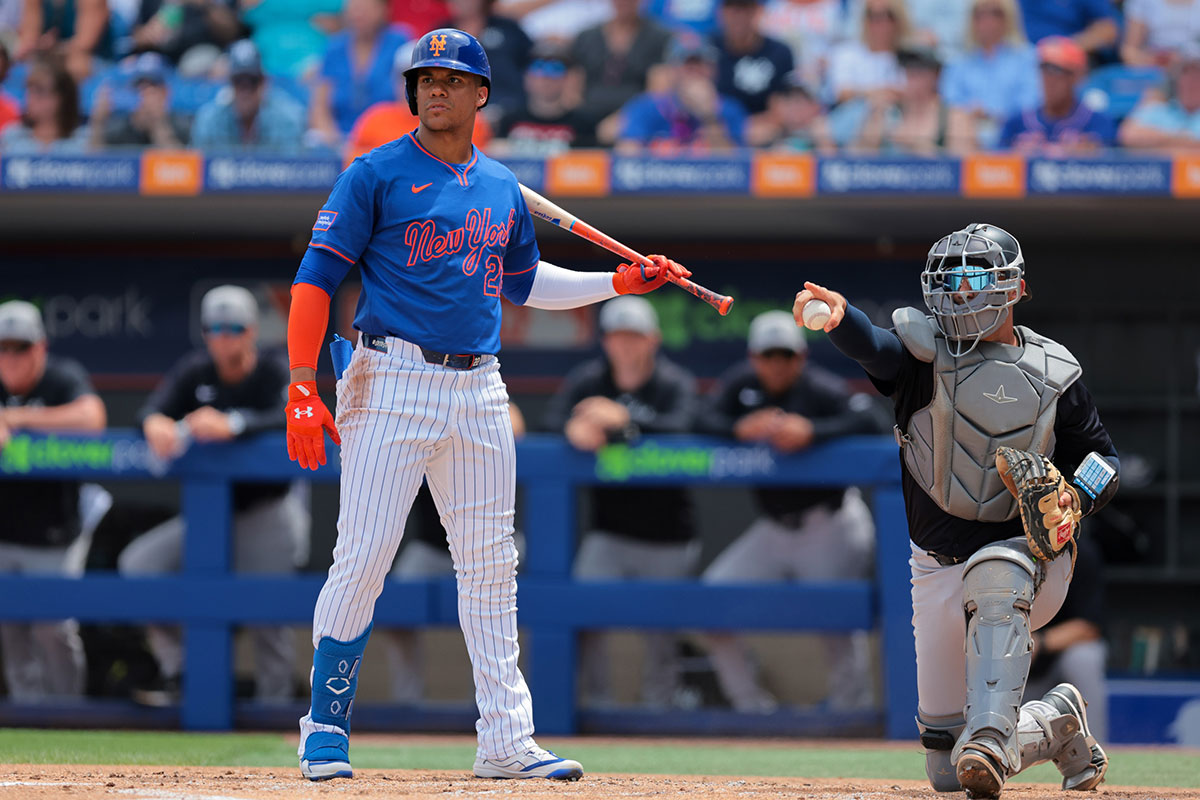 New York Mets right fielder Juan Soto (22) looks on toward third base as New York Yankees catcher J.C. Escarra (79) checks for a swing during the first inning at Clover Park.