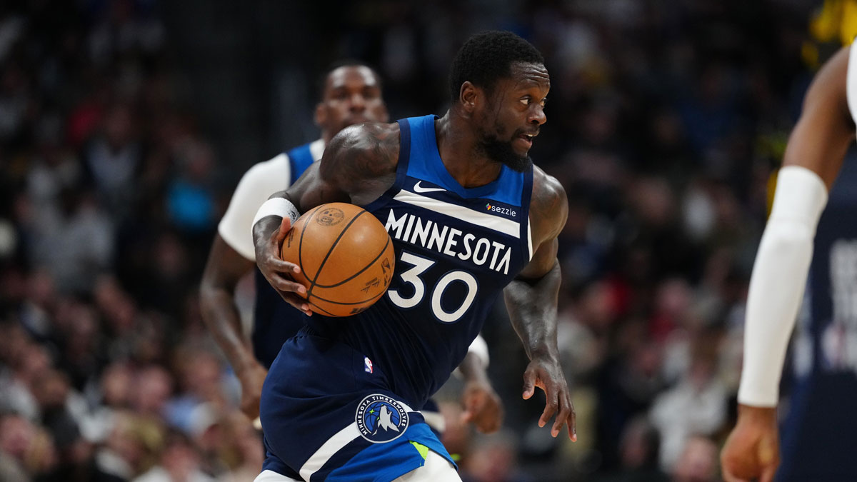 The Minnesota Timberwolves striker Julius Randle (30) controls the ball in the second quarter against the Denver Nuggets in Ball Arena.