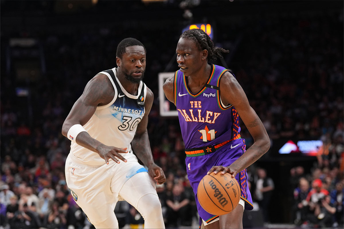 Phoenix Suns center Bol Bol (11) dribbles against Minnesota Timberwolves forward Julius Randle (30) during the second half at Footprint Center.