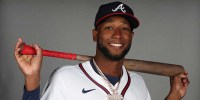 Feb 21, 2025; North Port, FL, USA; Atlanta Braves outfielder Jurickson Profar (7) takes photos during media day CoolToday Park.