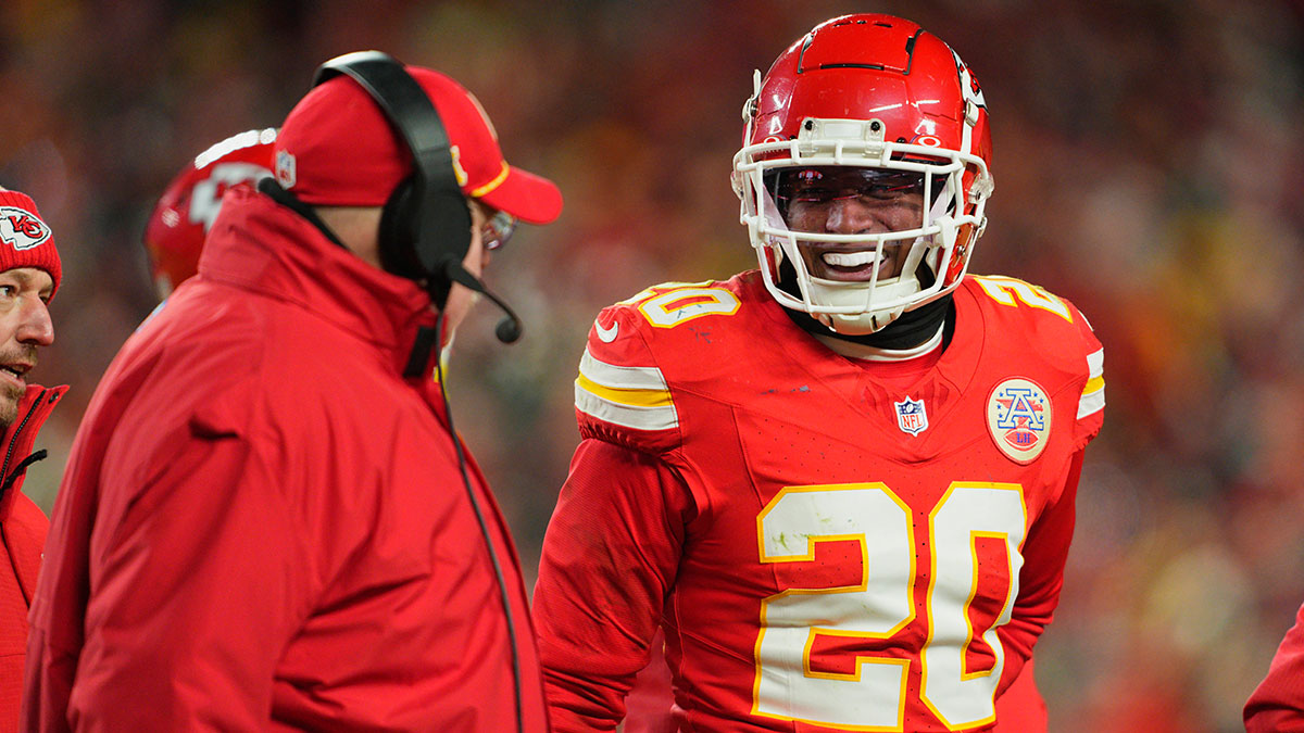 Kansas City Chiefs head coach Andy Reid (left) talks with safety Justin Reid (20) during the fourth quarter of a 2025 AFC divisional round game against the Houston Texans at GEHA Field at Arrowhead Stadium. 