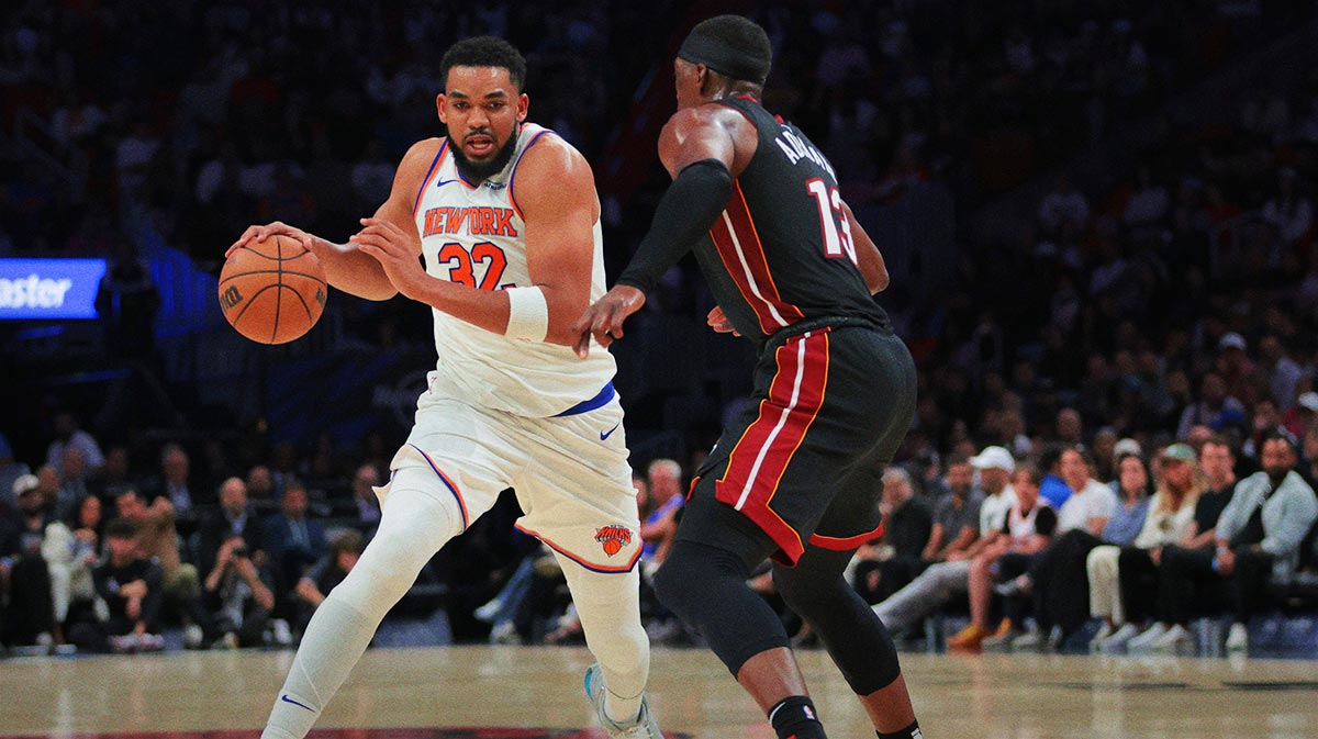 New York Knicks Center Karl-Anthony Cities (32) Drive to basket against Mayay Heat Center Bam Adebaiio (13) during the second quarter in Kaseia Center