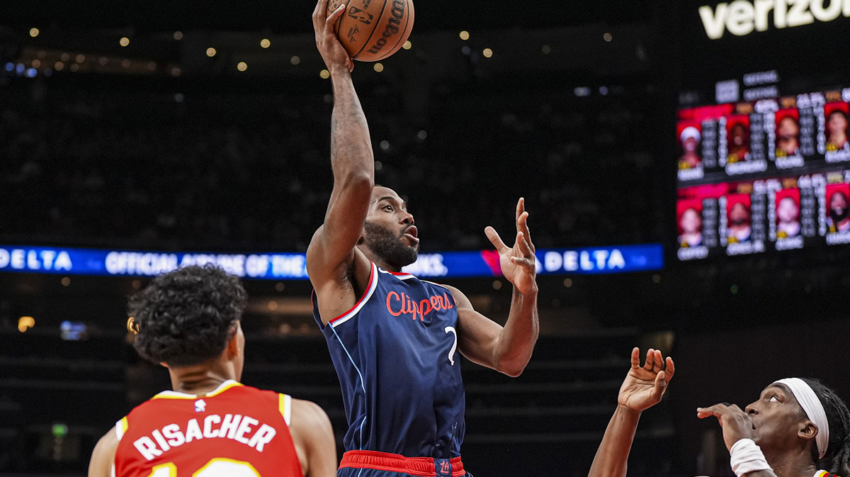 LA Clippers forward Kawhi Leonard (2) shoots between Atlanta Hawks forward Zaccharie Risacher (10) and guard Terance Mann (14) during the second half at State Farm Arena.