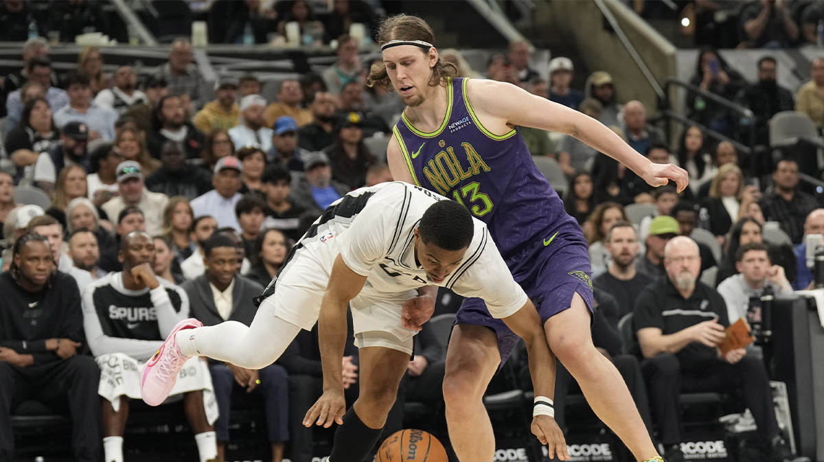 San Antonio Spurs forward Keldon Johnson (0) drives to the basket against New Orleans Pelicans forward Kelly Olynykc (13) during the second half at Frost Bank Center.