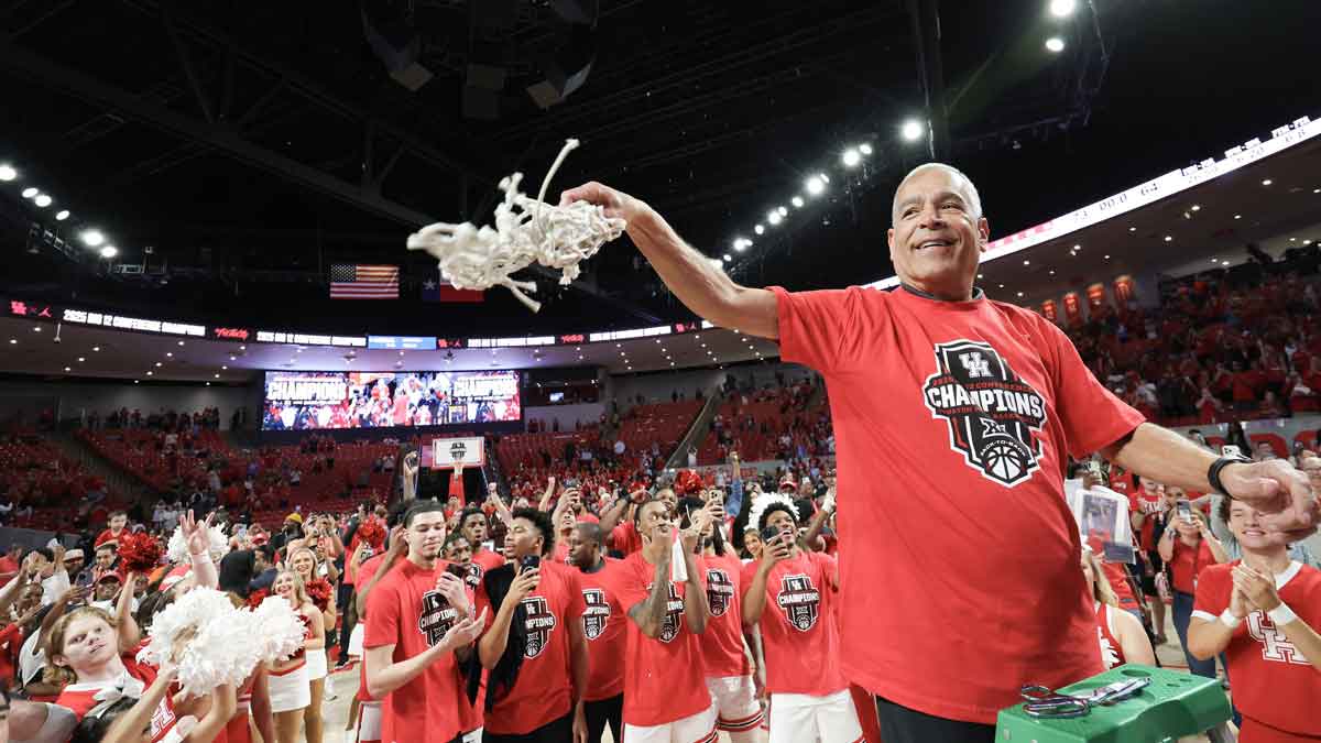 Houston Cougars head coach Kelvin Sampson cuts down the net and celebrates after winning the Big 12 Conference after defeating the Cincinnati Bearcats at Fertitta Center.