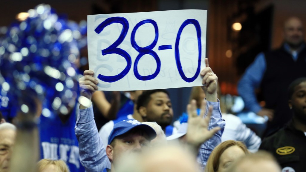 Kentucky Wildcats fans hold up a sign after the game against the Notre Dame Fighting Irish in the finals of the midwest regional of the 2015 NCAA Tournament at Quicken Loans Arena. Kentucky won 68-66.