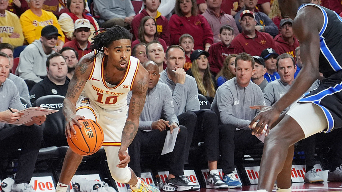 Iowa State Cyclones guard Keshon Gilbert (10) looks for drive around BYU Cougars's forward Mawot Mag (0) during the first half of the Big-12 men’s basketball in the Senior Day at Hilton Coliseum on March 4, 2025, in Ames, Iowa.