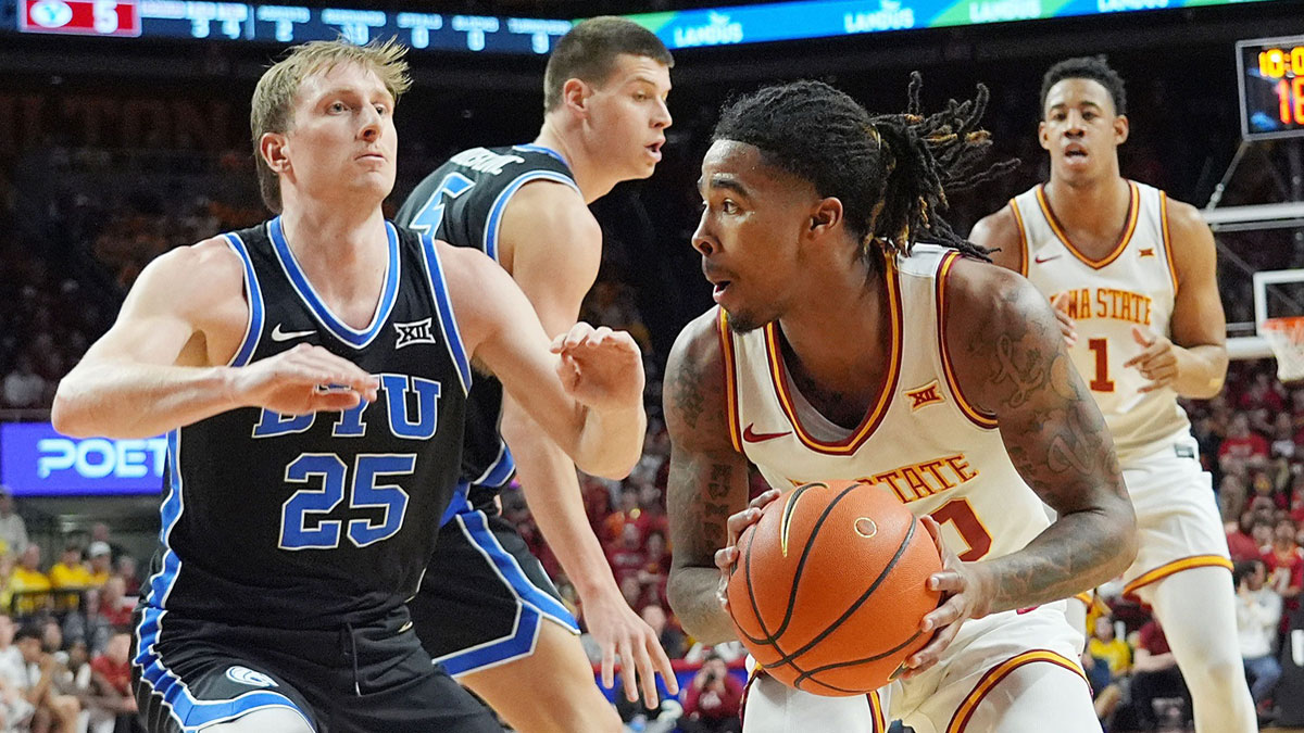 Iowa State Cyclones guard Keshon Gilbert (10) looks for a drive with the ball around BYU Cougars's guard Dawson Baker (25) during the first half of the Big-12 men’s basketball in the Senior Day at Hilton Coliseum